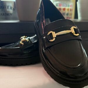 Steve Madden Glossy Black Loafers with Gold Buckle